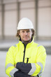 © FOLIO - Sweden, Portrait of man wearing reflective jacket and helmet