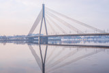 Fototapeta Na sufit - A panoramic image of the Vansu bridge that spans the river Daugava in the Latvian capital of Riga.