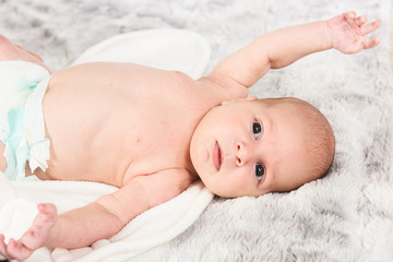 Wall Mural - Boy Laying on Towel and Blanket