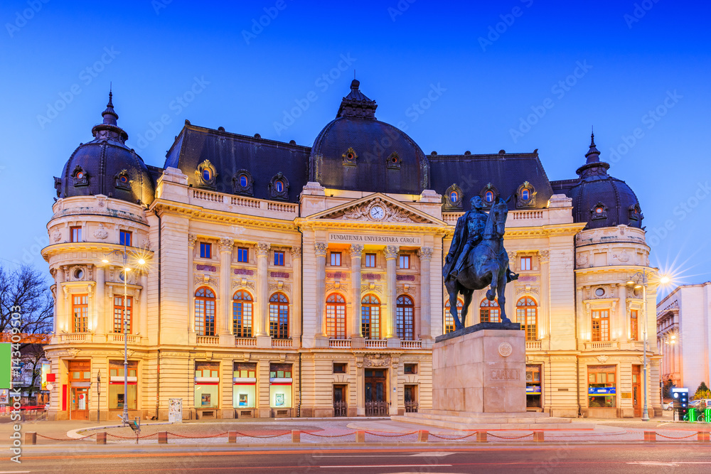 Obraz na płótnie Bucharest, Romania. The Central University Library and statue of King Carol I of Romania w salonie