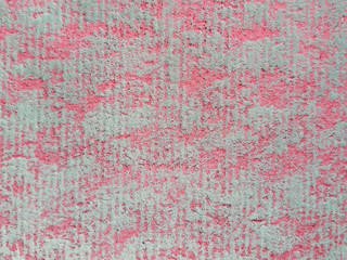 Textured paper with a pink pastel. 