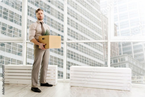 Fotografia, Obraz Full length of fired office worker standing in the office