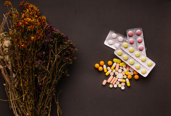 Medicinal herbs and tablets on the table