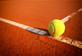 Fototapeta  - Tennis balls on a tennis clay court