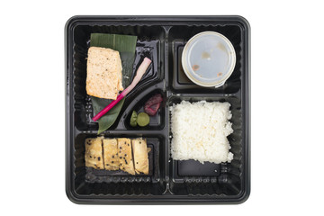 Meal / Rice, chicken, salmon and sauce in plastic food container on white background.