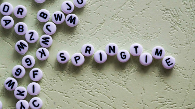 The word springtime made of round blocks.