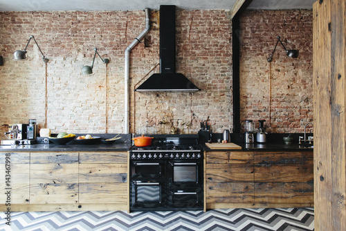 Modern Kitchen With Exposed Brick Wall And Lots Of Wood Buy This