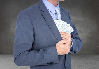 Canvas Print - Business man mid section putting money away against grey wall