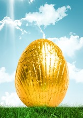Poster - Gold Easter egg in front of blue sky