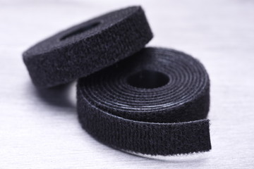 Roll of Velcro Tapes on Gray Metal Surface