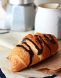 Chocolate croissant on the baking paper