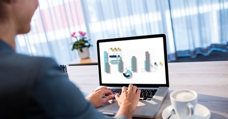 Poster - Businesswoman analyzing graphs on laptop at desk