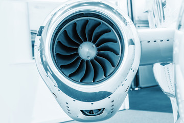 detailed insigh tturbine blades of an aircraft jet engine, colored technical blue, business jet engine close up high detailed view