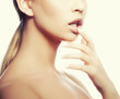 © beauty_objects - Close-up sexy lips touching by young woman with clean bright toned skin