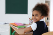 © Africa Studio - Portrait of cute African-American girl in classroom