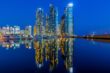 Wall Mural - Busan city skyline view at Gwangalli beach, Haeundae district, Yacht parking at modern building architecture Haeundae beach, Busan, South Korea