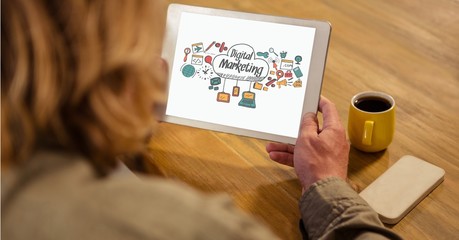 Poster - Businesswoman holding tablet PC with digital marketing sign