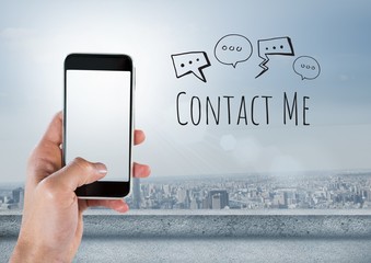 Fototapete - Hand holding phone and Contact Me text with drawings graphics