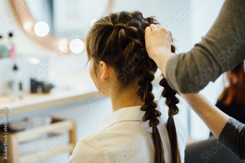 Super Styling Close Up Of A Hairdresser Braiding Her Clients Hair