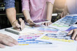 © snowing12 - Designers Working Together At Desks In Modern Office