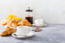 Healthy Breakfast With Coffee, Croissants And Orange Juice On Light Gray Background, Selective Focus, Copy Space.