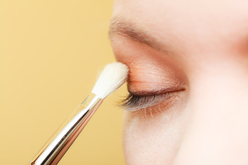 Close up woman getting make up, eyeshadow