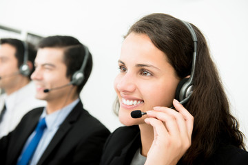 Wall Mural - Beautiful smiling woman working in call center