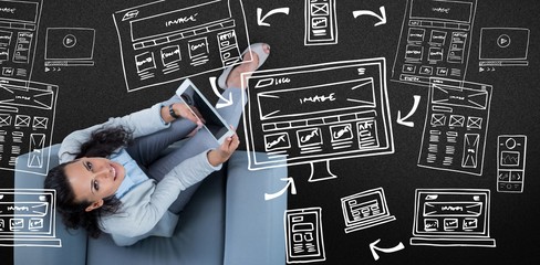 Poster - Composite image of woman on her tablet looking up