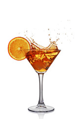 Splash in glass of transparent alcoholic cocktail drink with slice orange and ice