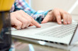 © Saklakova - Business man working and analyzing financial figures on a graphs using laptop