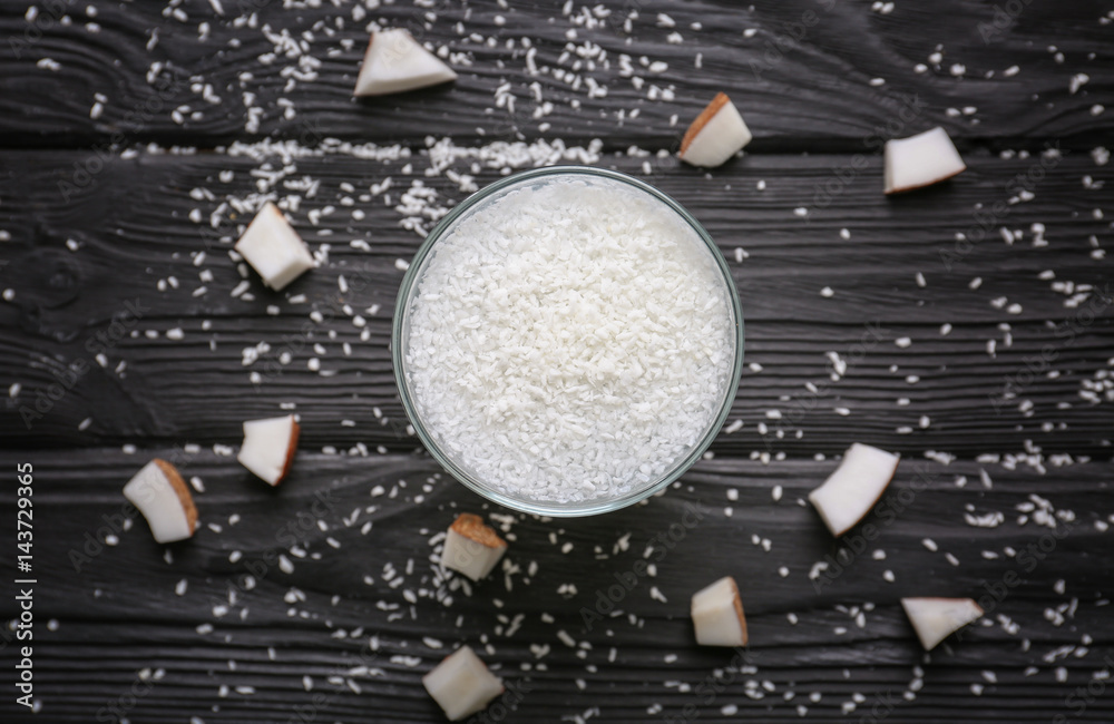 Glass of coconut water on wooden table