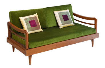 Green velvet sofa on wooden base