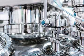 Steel pipe with a stopcock on the cover of the pharmaceutical reactor.