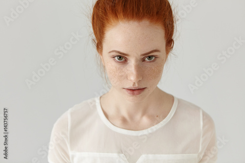 Top View Of Beautiful Caucasian Female With Freckles All Over Her Face