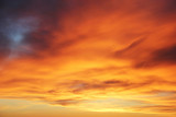 Fototapeta Zachód słońca - Orange sunset on the cloudy sky