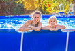 © Alliance - happy active mother and child in swimming pool relaxing