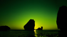 Camel Rock In Nui Bay At Phi Phi Don During Lime Green Sunset, Thailand