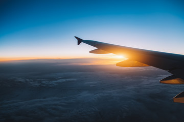 Wall Mural - aerial view from airplane window at sunset