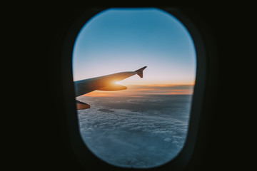Wall Mural - aerial view from airplane window at sunset