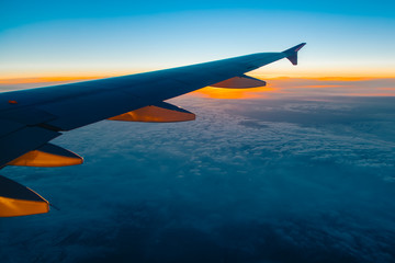 Wall Mural - aerial view from airplane window at sunset