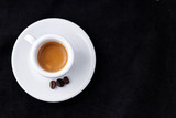 Fototapeta Mapy - Espresso cup on a black background