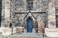 An Arched Doorway To An Old Gothic Style Catholic Church Or Chapel