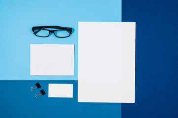 Poster - Mock-up magazine or catalog on colorful table. White page or notepad on modern background. Blank copy space for mockups or simulations.