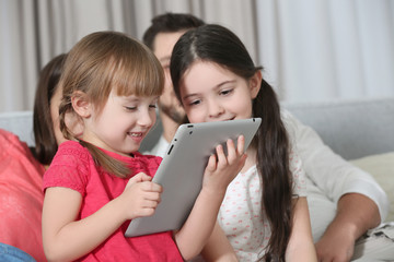 Wall Mural - Little girls with tablet at home