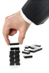 Wall Mural - Milestone or progress concept - business man building domino tower