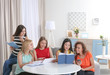 © Africa Studio - Young women sitting at table in book club