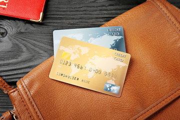 Wall Mural - Composition with credit cards on wooden background. Travel concept