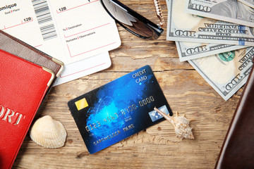 Poster - Credit card with money and passports on wooden background