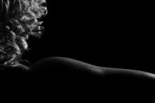 Beautiful Sexy Kinky Blonde Female, In Oil With Drops Of Water On The Body, Tender Bends Of The Naked Neck, Shoulder And Forearm, Gorgeous In The Darkness. Black And White Photo.
