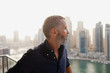 © phocal Media - Expat man at balcony.